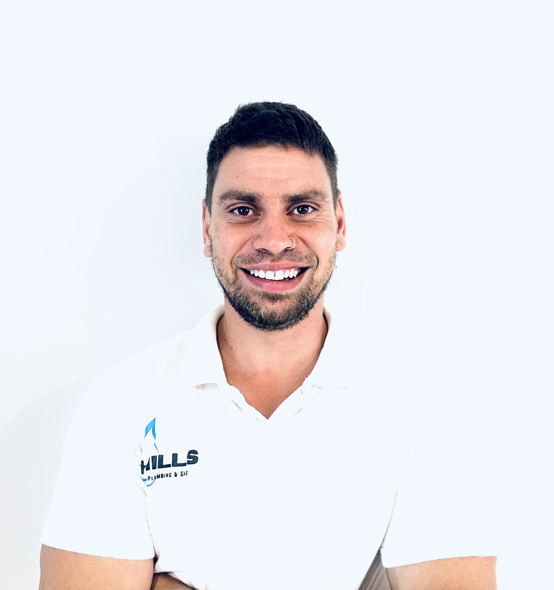 The owner of Hills Plumbing & Gas in the white Hills polo